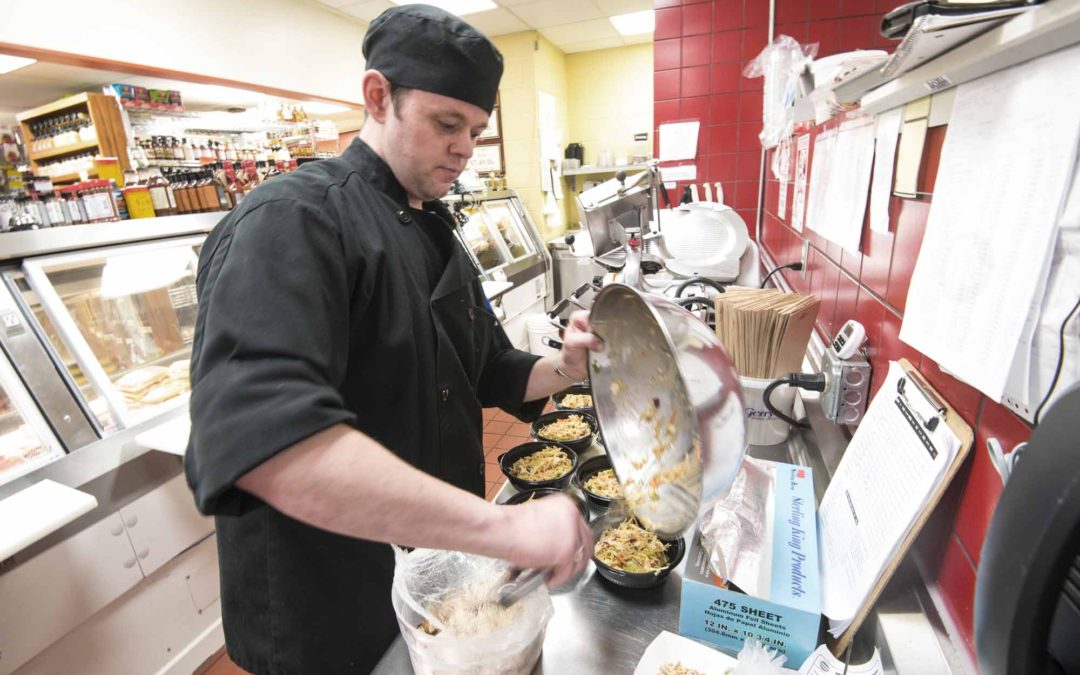 Chef Alan, working in the deli making delicious foood