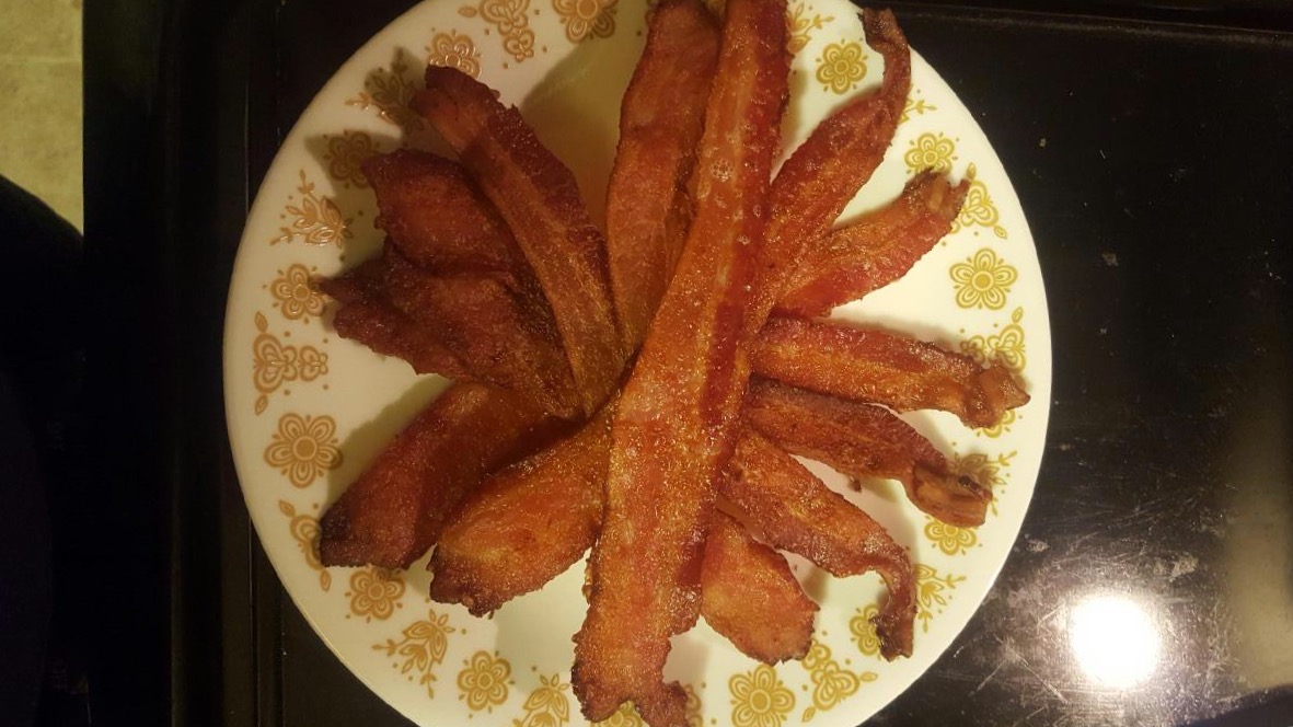 Perfectly cooked bacon on a tray.